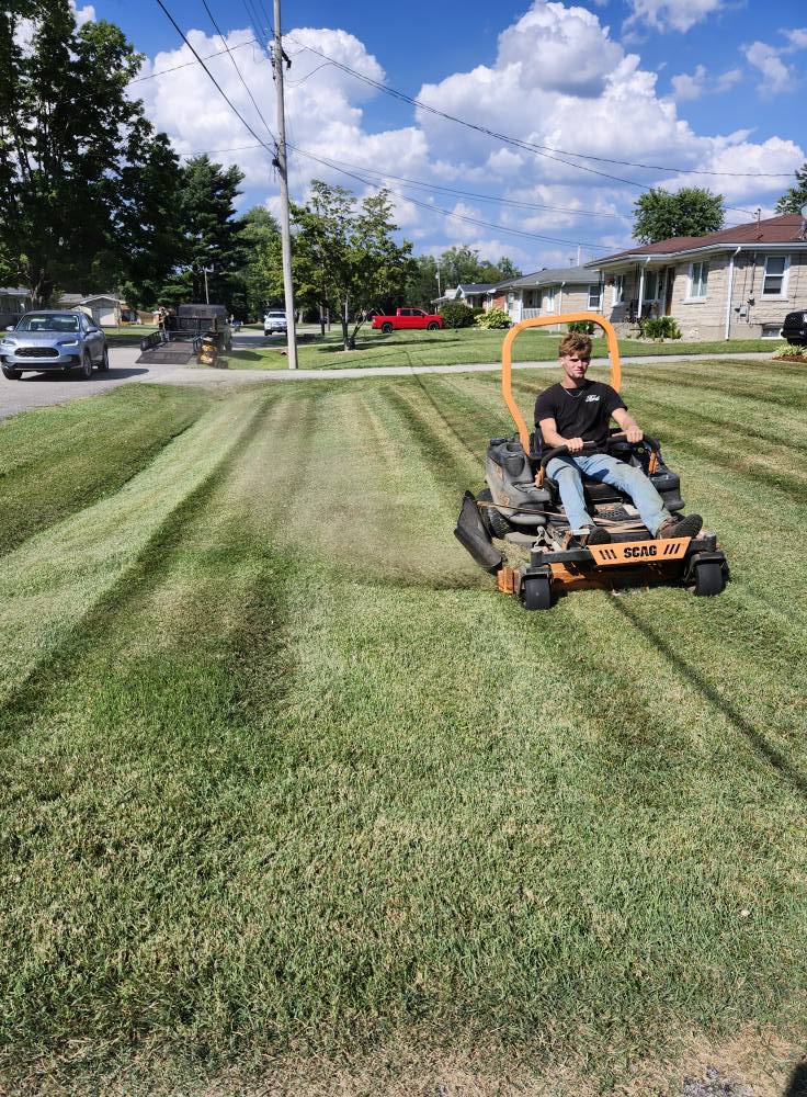 Crew on zero-turn mower